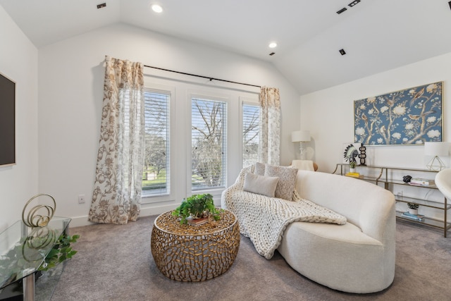 living area with vaulted ceiling and carpet floors