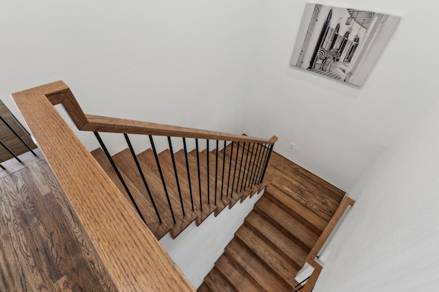 stairs with wood-type flooring