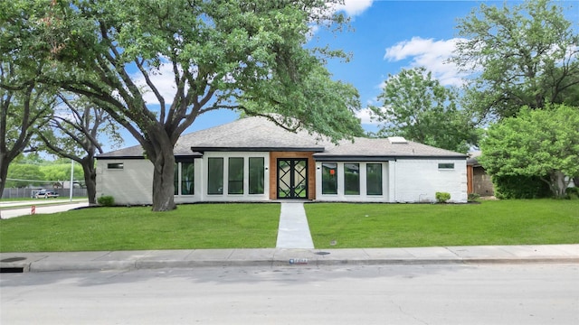 view of front of property with a front lawn