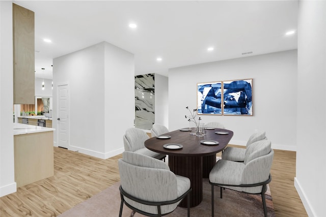 dining area featuring light hardwood / wood-style flooring