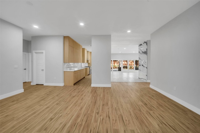 unfurnished living room featuring light hardwood / wood-style flooring