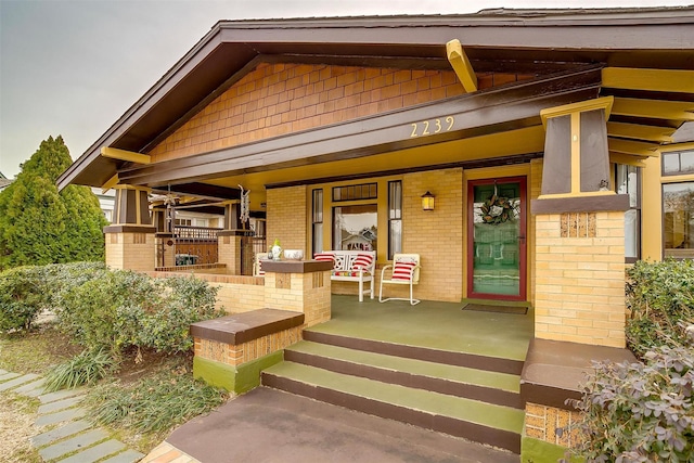 doorway to property with a porch