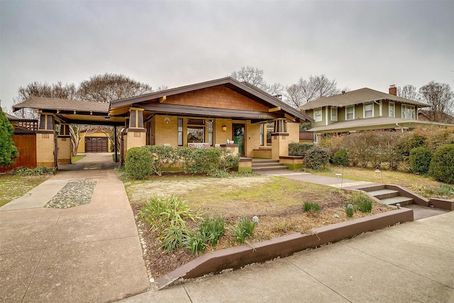 view of front of house featuring a carport and a porch