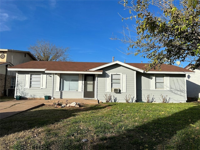 ranch-style home with cooling unit and a front yard