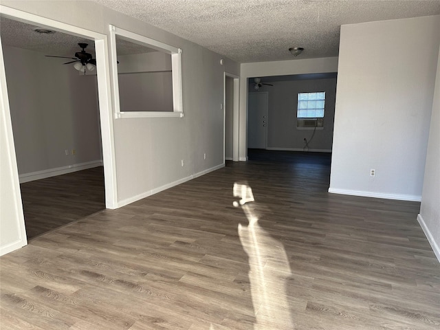 unfurnished room featuring hardwood / wood-style floors, a textured ceiling, and ceiling fan