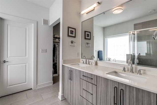 bathroom with vanity and walk in shower