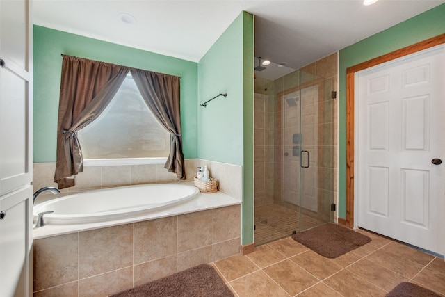 bathroom featuring independent shower and bath and tile patterned flooring