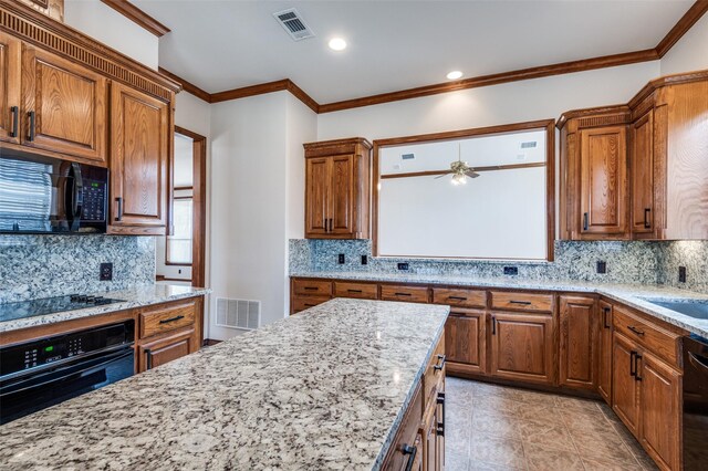 kitchen with sink, ornamental molding, and tile countertops