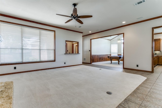 interior space with visible vents, ceiling fan, ornamental molding, light carpet, and billiards