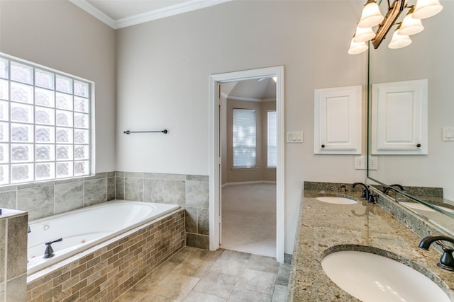 bathroom featuring a sink, a jetted tub, and crown molding