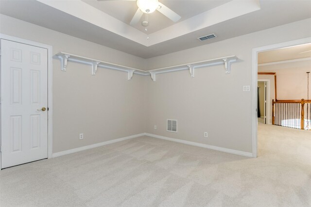 carpeted empty room with ceiling fan and lofted ceiling