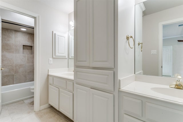 full bath featuring tile patterned floors, shower / washtub combination, toilet, and vanity