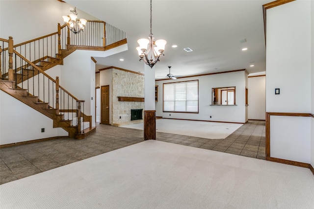 carpeted living area featuring tile patterned floors, stairs, crown molding, and baseboards