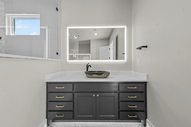 bathroom featuring vanity and walk in shower