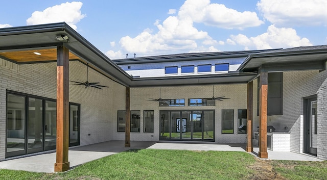 back of house with ceiling fan, a patio, and a yard