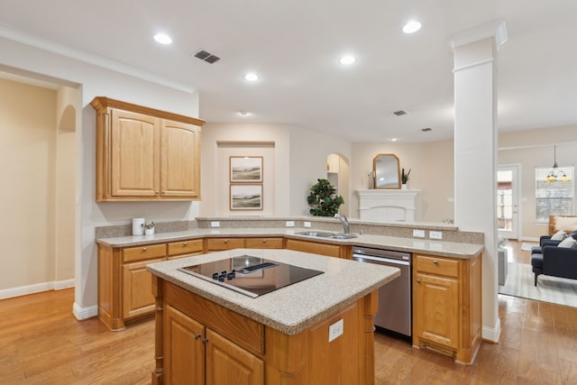 kitchen with light hardwood / wood-style floors, sink, stainless steel dishwasher, and black electric cooktop