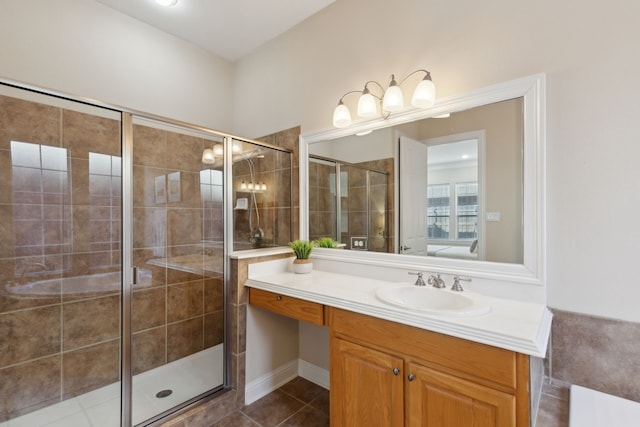 bathroom with vanity, an enclosed shower, and tile patterned flooring