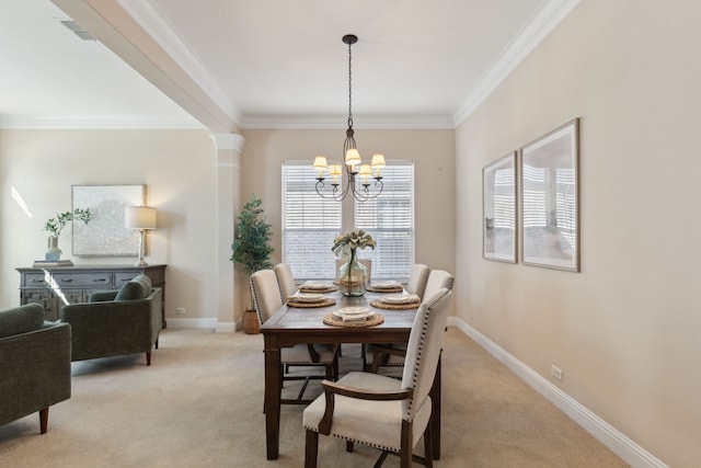 carpeted dining space featuring ornate columns, crown molding, and a chandelier