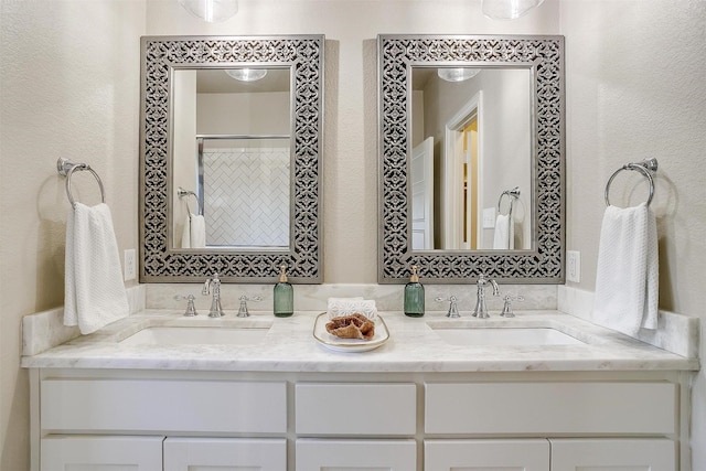 bathroom featuring a shower with curtain and vanity