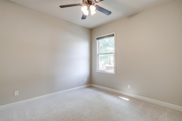 unfurnished room featuring ceiling fan and carpet