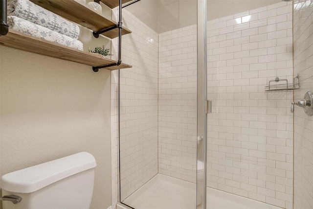 bathroom with toilet and walk in shower