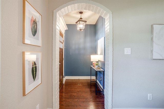 hallway featuring dark wood-type flooring