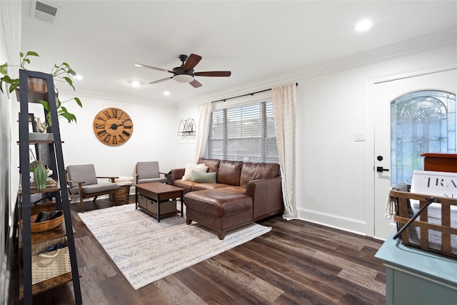 living room with ceiling fan, dark hardwood / wood-style flooring, and ornamental molding