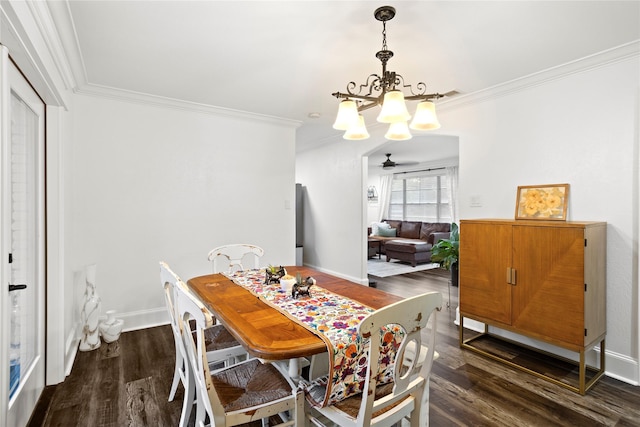 dining room featuring a notable chandelier, ornamental molding, and dark wood-type flooring