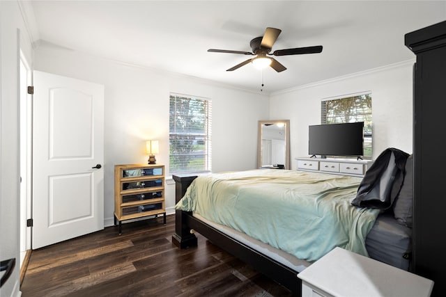 bedroom with crown molding, multiple windows, ceiling fan, and dark hardwood / wood-style flooring