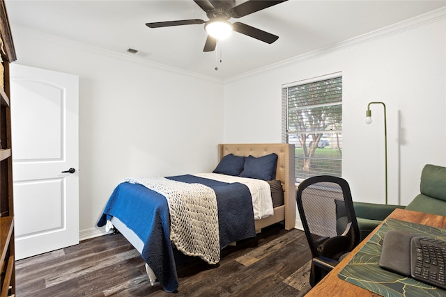 bedroom with crown molding, dark wood-type flooring, and ceiling fan