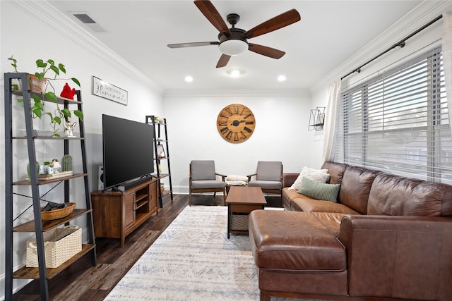 living room featuring ceiling fan, dark hardwood / wood-style floors, and ornamental molding