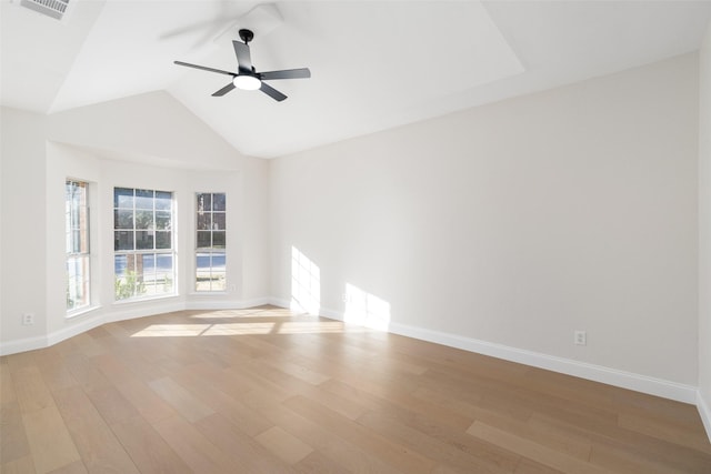 unfurnished room featuring light hardwood / wood-style flooring, ceiling fan, and vaulted ceiling