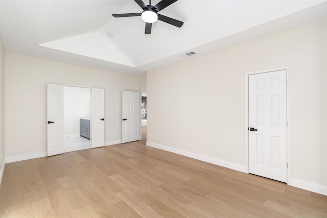 unfurnished bedroom featuring vaulted ceiling, light hardwood / wood-style floors, and ceiling fan