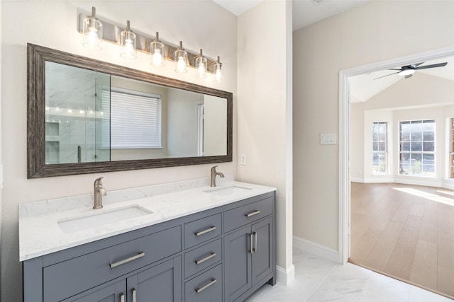 bathroom featuring vanity, an enclosed shower, and ceiling fan