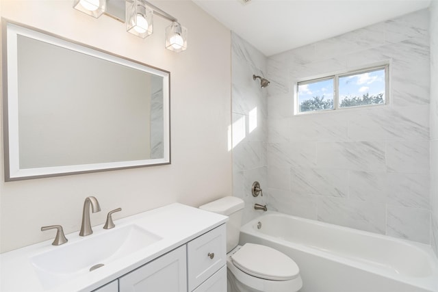 full bathroom featuring vanity, toilet, and tiled shower / bath combo