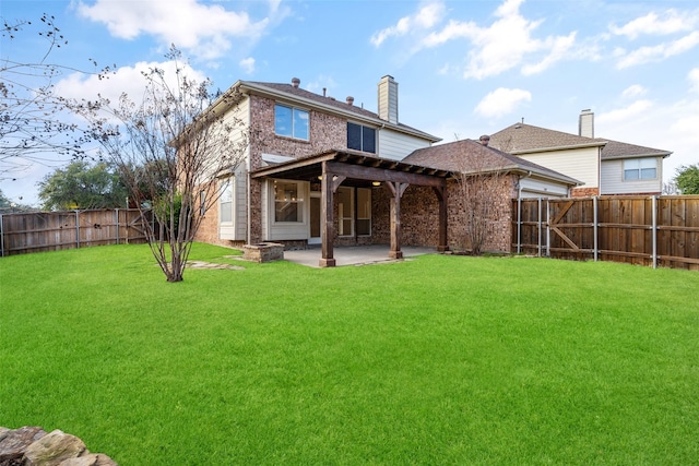 back of property with a patio area and a lawn