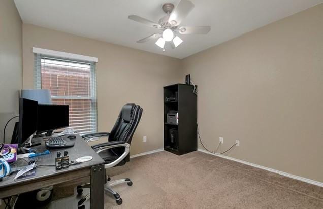 office space featuring light colored carpet and ceiling fan