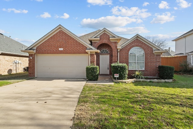 front of property featuring a front yard and a garage