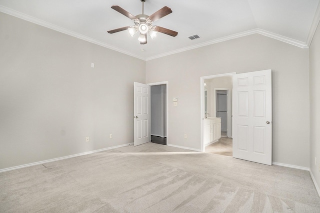 unfurnished bedroom featuring light carpet, visible vents, baseboards, lofted ceiling, and crown molding