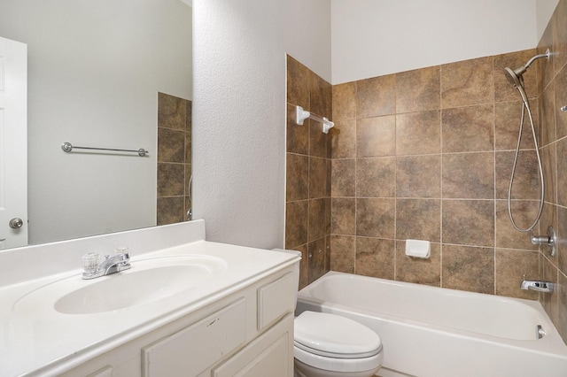 full bathroom featuring tub / shower combination, vanity, and toilet