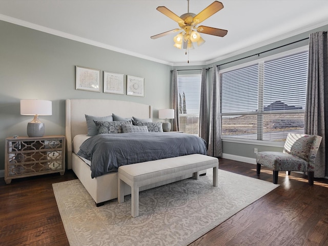 bedroom with dark hardwood / wood-style flooring, ornamental molding, and ceiling fan