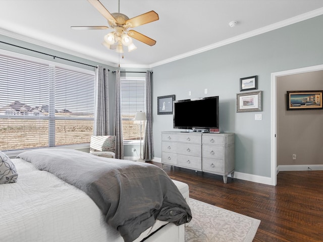 bedroom with dark hardwood / wood-style flooring, ornamental molding, and ceiling fan