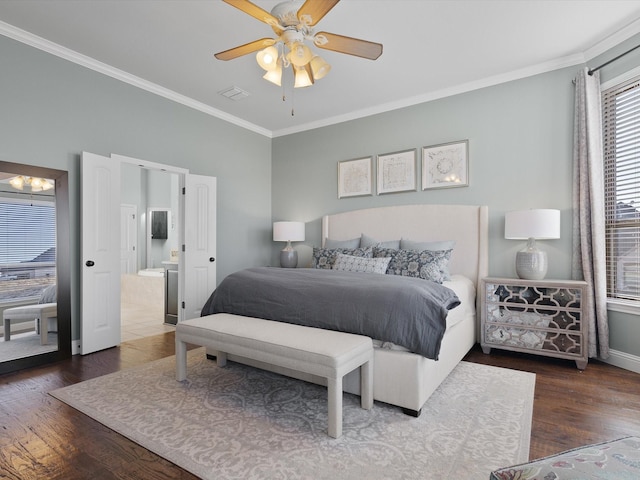 bedroom with dark wood-type flooring, ceiling fan, and crown molding