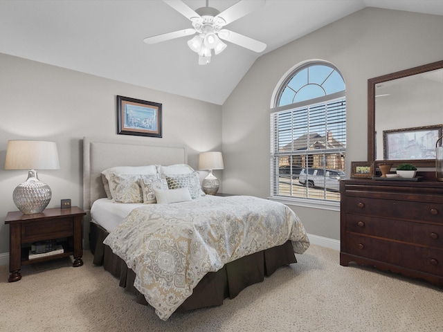 bedroom with lofted ceiling, light colored carpet, and ceiling fan