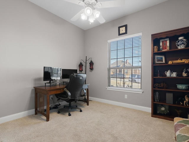 carpeted office with ceiling fan