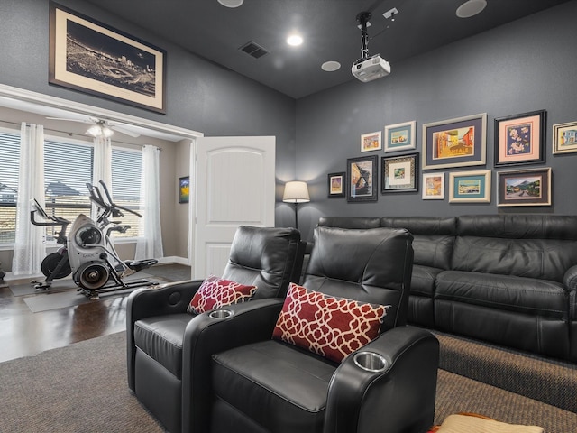 cinema room with hardwood / wood-style flooring