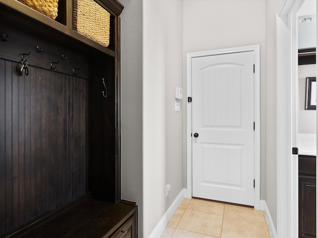 mudroom with light tile patterned flooring