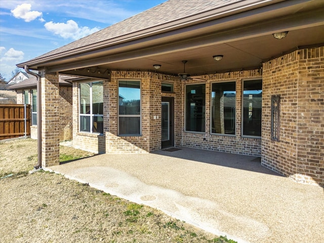 exterior space with ceiling fan