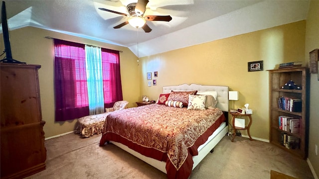 carpeted bedroom with ceiling fan and lofted ceiling