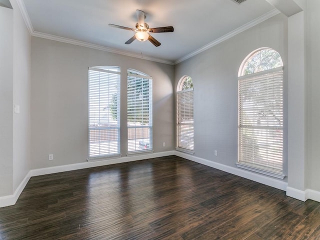 spare room featuring ceiling fan, dark hardwood / wood-style flooring, and crown molding